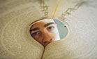 guy looking through book